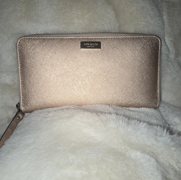 kate spade Handbags - kate spade rose gold zip around wallet